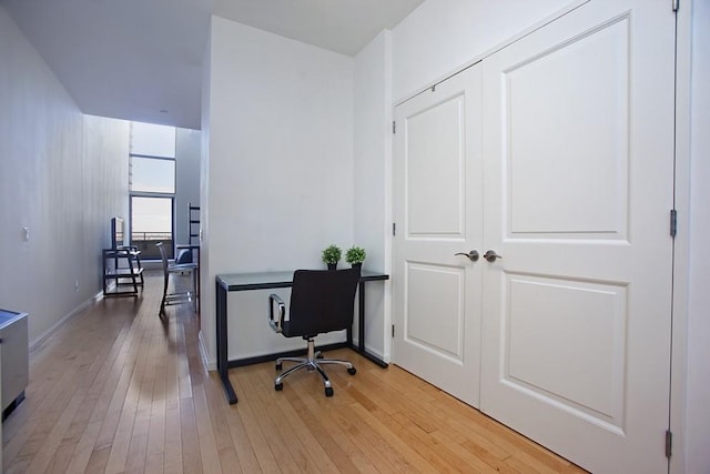 office featuring light wood-style floors and baseboards