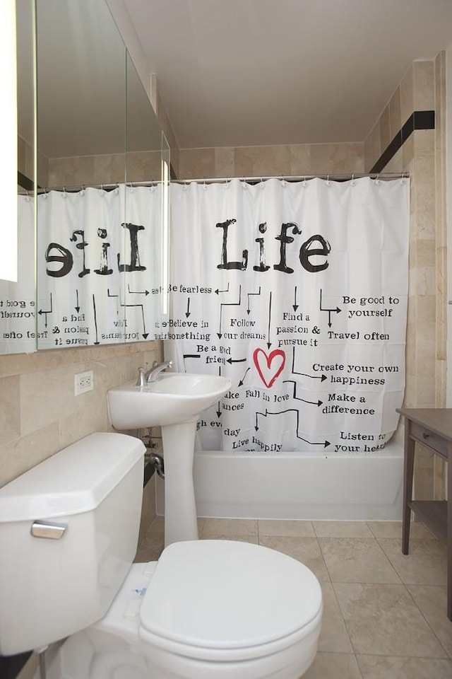 full bath with tile patterned flooring, tile walls, toilet, tasteful backsplash, and shower / tub combo with curtain