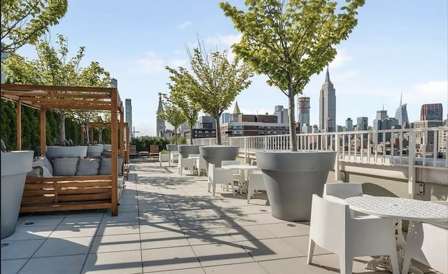 view of patio featuring an outdoor hangout area and a city view