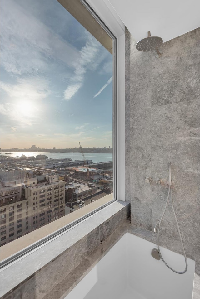 bathroom with a shower and a water view