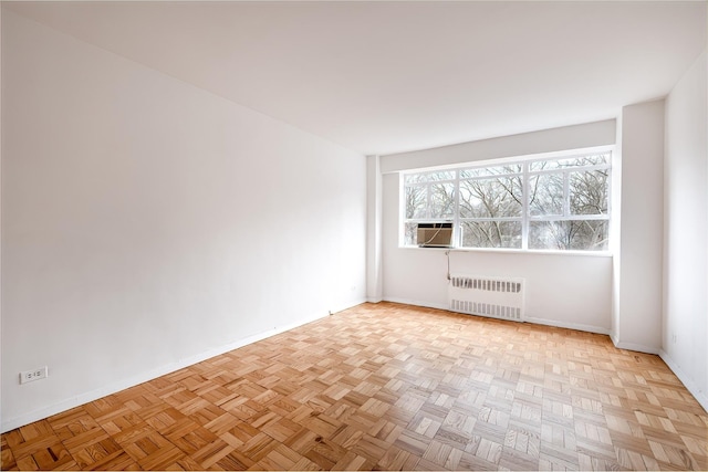 2727 Palisade Ave Unit 9-B, New York City, NY 10463 - empty room featuring radiator heating unit, baseboards, and cooling unit