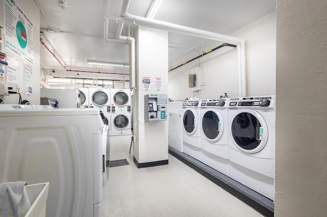 2727 Palisade Ave Unit 9-B, New York City, NY 10463 - shared laundry room with washing machine and clothes dryer, tile patterned floors, and stacked washer / drying machine