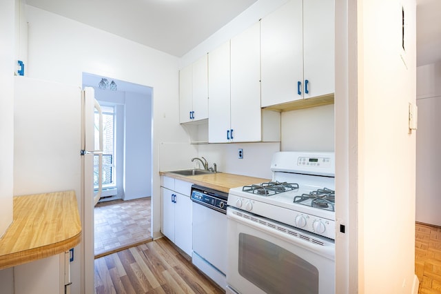 2727 Palisade Ave Unit 9-B, New York City, NY 10463 - kitchen with white appliances, a sink, wooden counters, white cabinets, and parquet floors