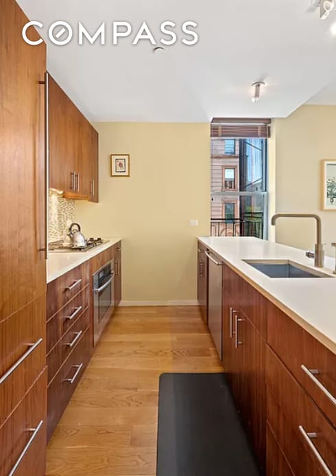 2605 Frederick Douglass Blvd Unit 3B, New York City, NY 10030 - kitchen featuring a sink, stainless steel appliances, modern cabinets, light wood-style flooring, and light countertops