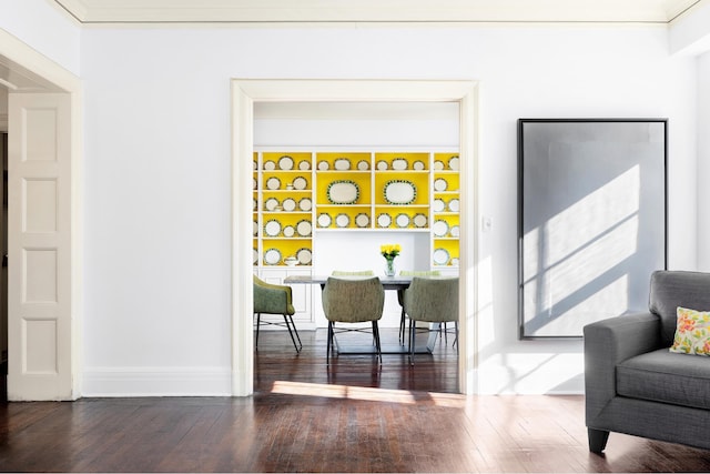 interior space with baseboards and wood-type flooring