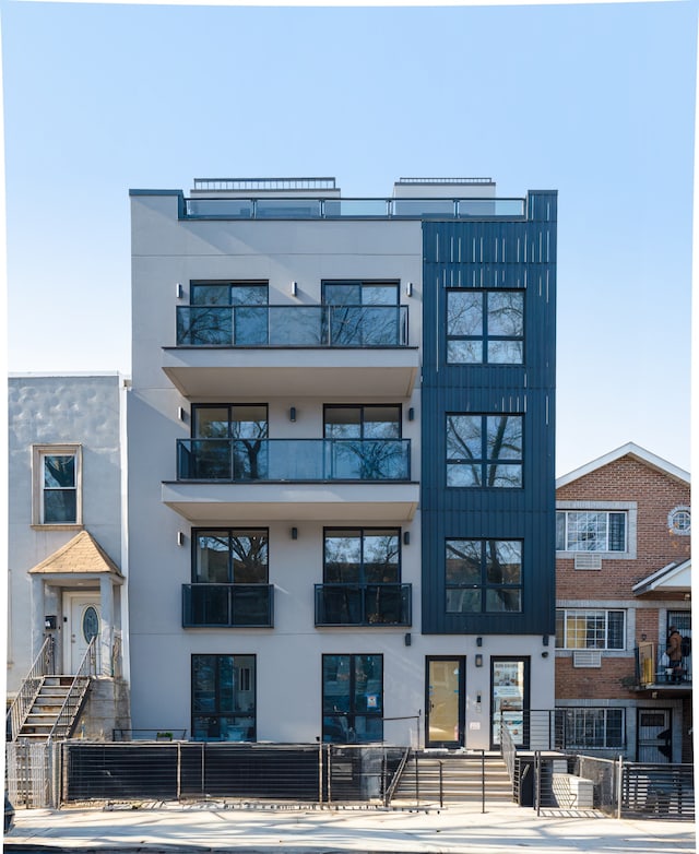 87A Cooper St Unit 2-F, New York City, NY 11207 - view of property with a fenced front yard