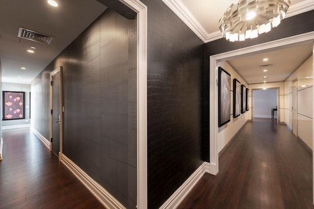 hallway featuring visible vents, baseboards, ornamental molding, recessed lighting, and dark wood-style floors