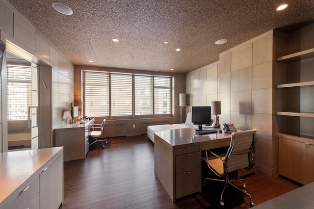 office featuring tile walls, recessed lighting, dark wood-type flooring, and a textured ceiling