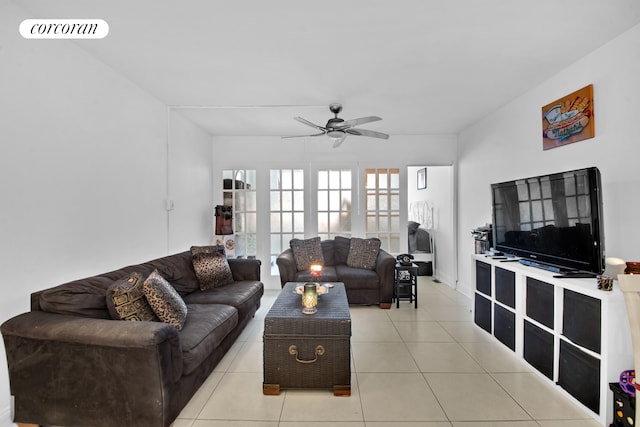 living room with ceiling fan, visible vents, and light tile patterned flooring