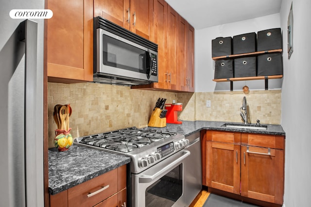 225 E 36th St Unit 1F, New York City, NY 10016 - kitchen with stainless steel appliances, a sink, brown cabinets, tasteful backsplash, and dark stone counters