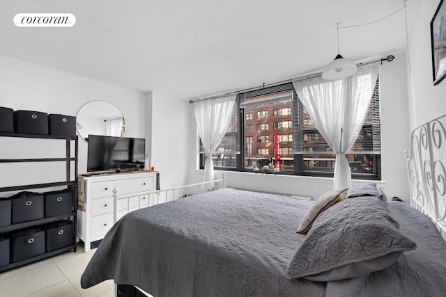 225 E 36th St Unit 1F, New York City, NY 10016 - tiled bedroom with multiple windows