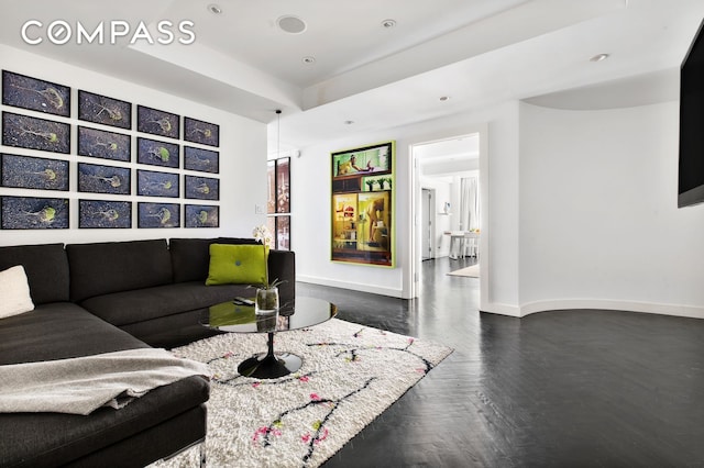 living room with recessed lighting and baseboards