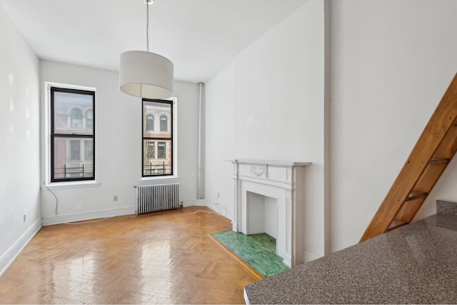 346 W 87th St, New York City, NY 10024 - living area with radiator heating unit, baseboards, a premium fireplace, and stairs