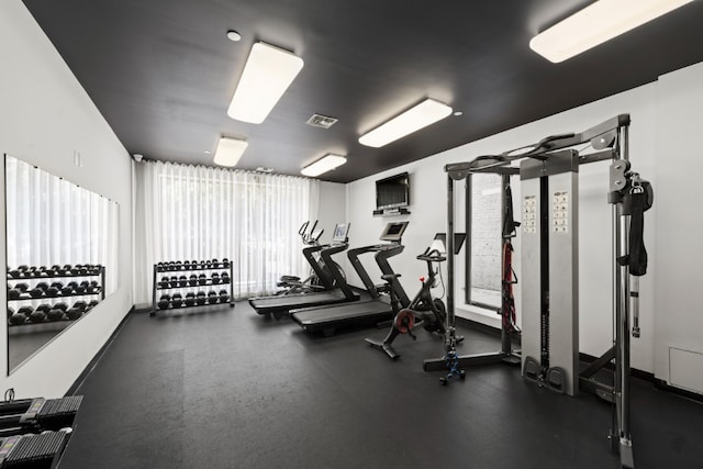 exercise room featuring visible vents