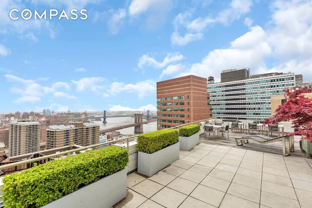 view of patio / terrace featuring a city view and a balcony