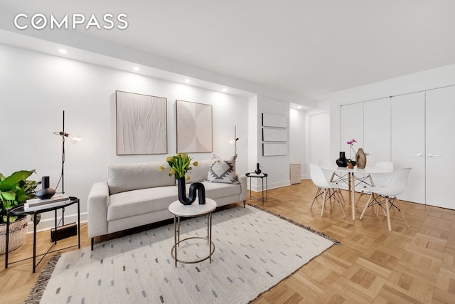 living room featuring recessed lighting and baseboards