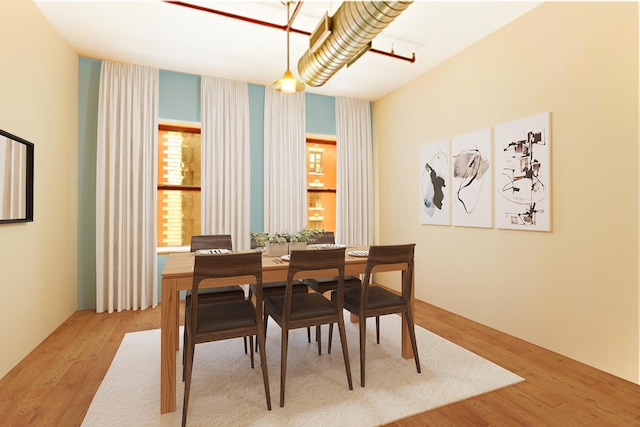 dining area with wood finished floors