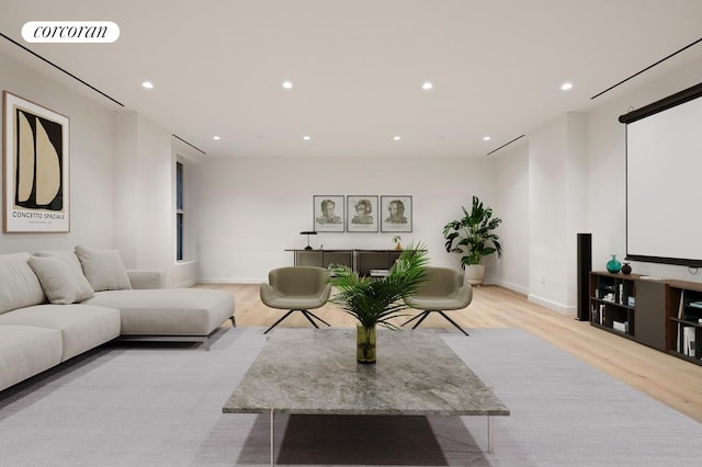 living room with light wood-style flooring, recessed lighting, visible vents, and baseboards