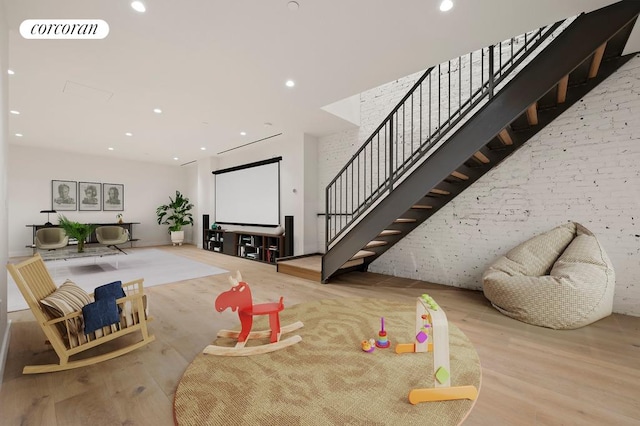 living area with visible vents, recessed lighting, stairway, and wood finished floors