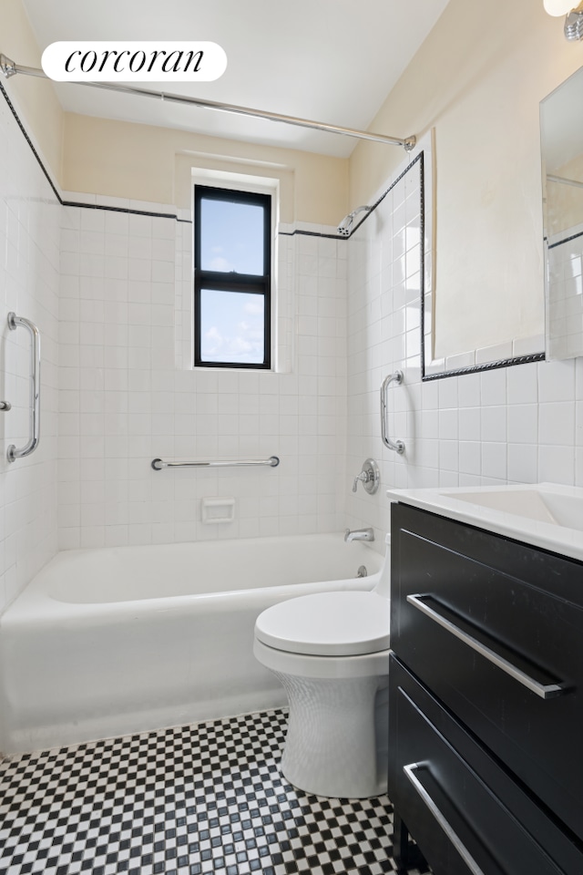 50 W 106th St Unit 15A, New York City, NY 10025 - full bath with tile patterned floors, vanity, shower / tub combination, and tile walls