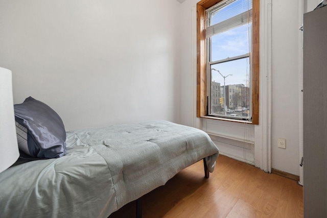 bedroom featuring light wood-style flooring