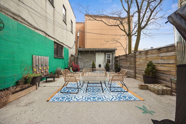 view of patio with an outdoor hangout area and a fenced backyard