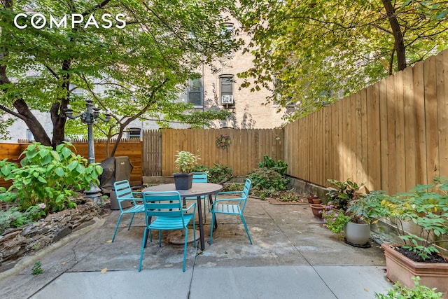 view of patio / terrace with a fenced backyard and outdoor dining space