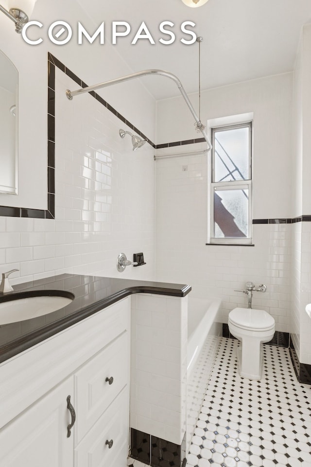 full bath featuring toilet, a tub, tile walls, a shower, and vanity