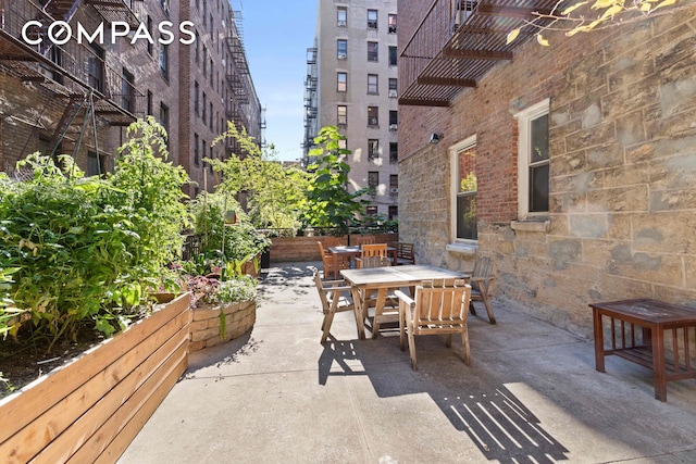 view of patio featuring outdoor dining area