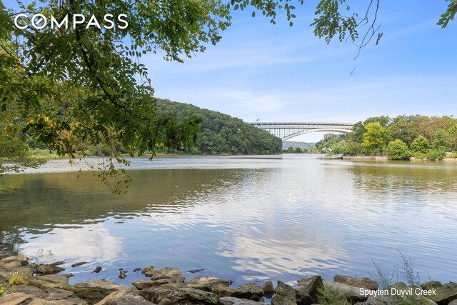680 W 204th St Unit 5E, New York City, NY 10034 - water view with a notable bridge