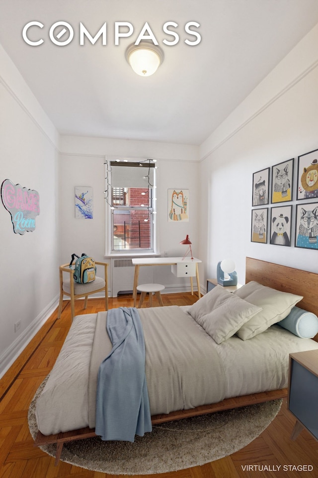 bedroom featuring radiator heating unit and baseboards