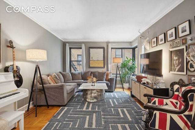 living area featuring crown molding and baseboards