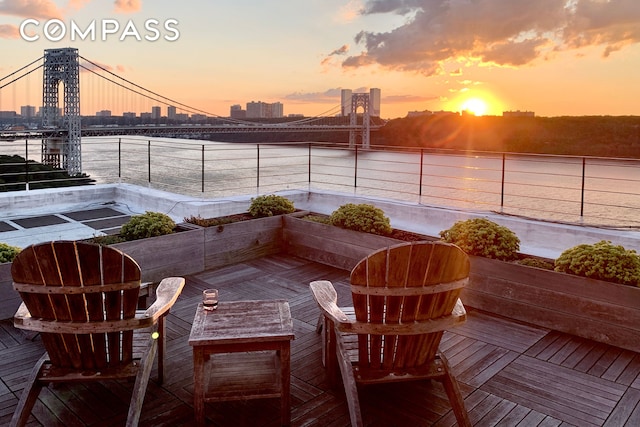 balcony with a city view and a water view