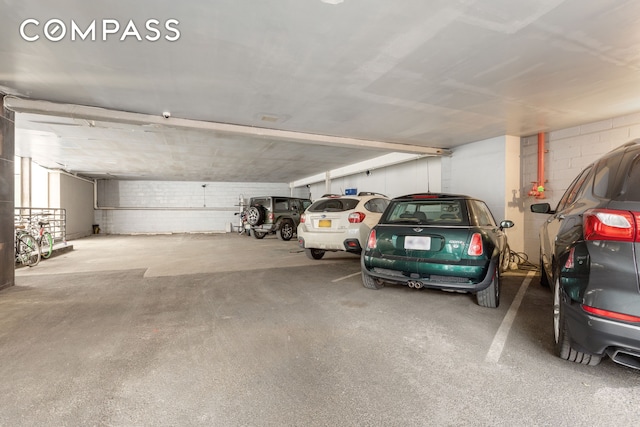 parking deck featuring concrete block wall