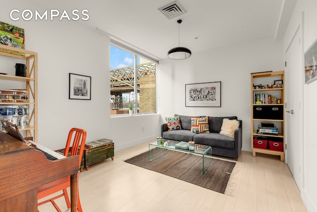 interior space featuring visible vents and wood finished floors