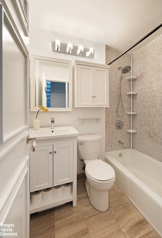 bathroom with vanity, toilet, and shower / washtub combination