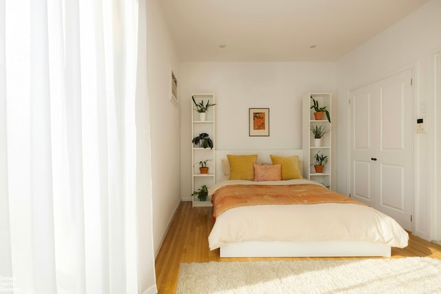 bedroom with light wood-style flooring