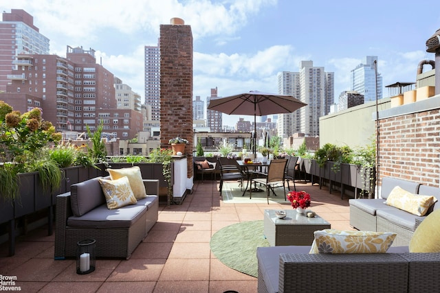 view of patio featuring a city view and an outdoor hangout area