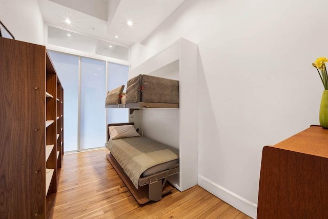 bedroom featuring recessed lighting, baseboards, and hardwood / wood-style floors