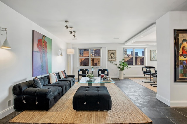 living area featuring baseboards