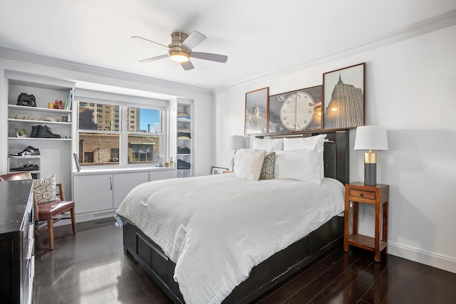 bedroom with a ceiling fan, crown molding, wood finished floors, and baseboards