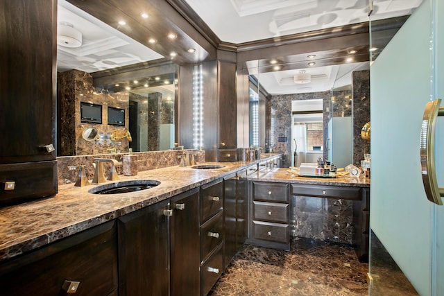 bathroom featuring ornamental molding, coffered ceiling, marble finish floor, and a sink