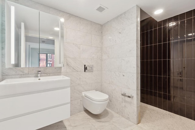 full bathroom with visible vents, toilet, and tile walls