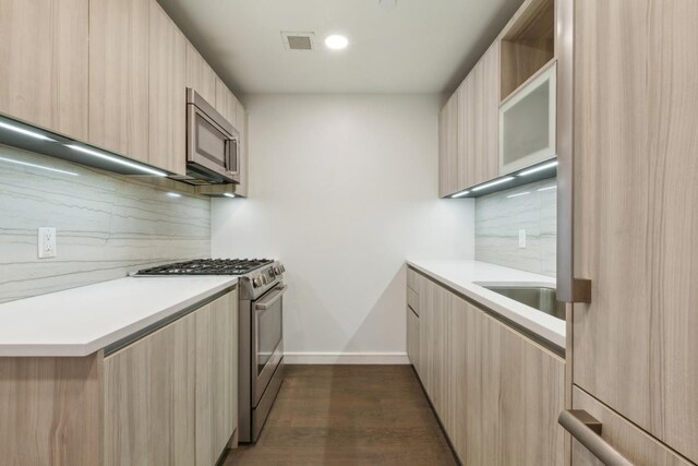 dining room with baseboards and wood finished floors