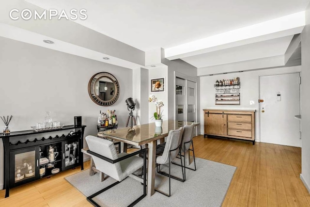 dining space with light wood-style flooring