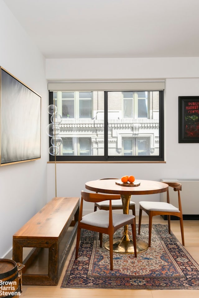 dining space featuring wood finished floors