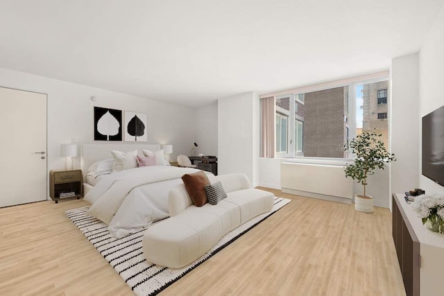 bedroom featuring wood finished floors