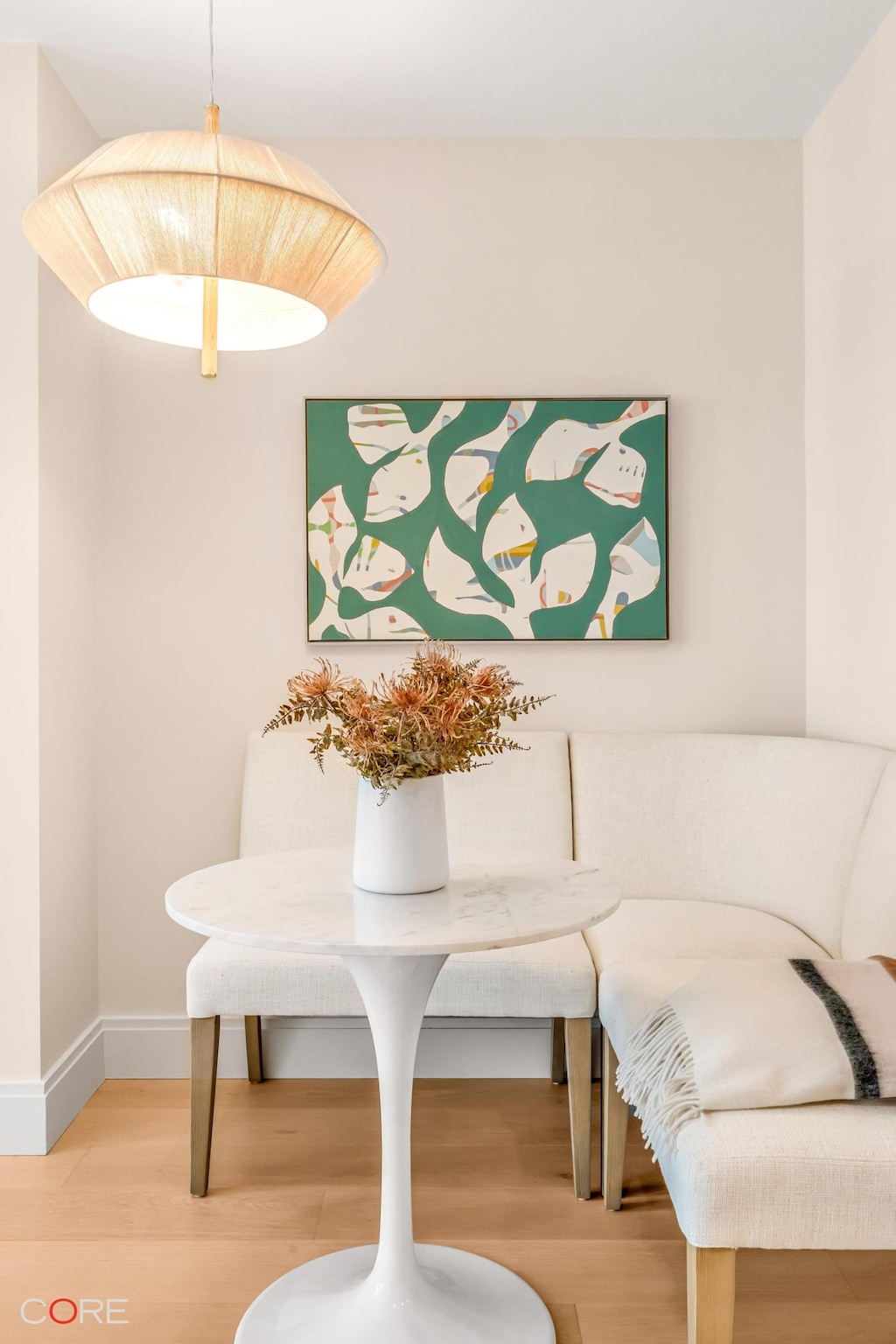 dining area with baseboards and wood finished floors