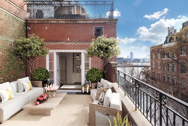 balcony featuring a view of city and outdoor lounge area