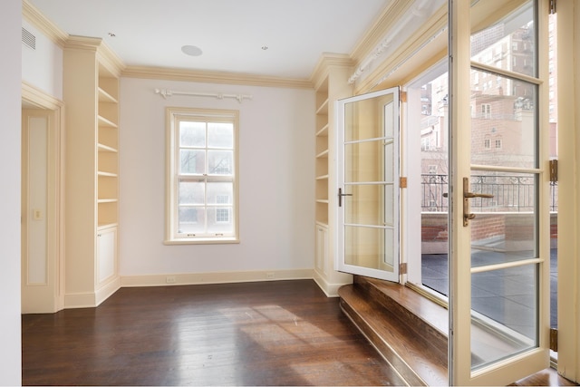 interior space featuring french doors, baseboards, dark wood-style flooring, and crown molding